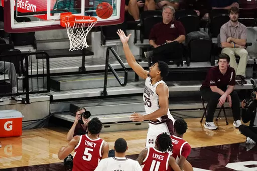 Mississippi State forward Tolu Smith (35) stretches out to make a layup against Arkansas during the second half of an NCAA college basketball game in Starkville, Miss., Wednesday, Dec. 29, 2021. (AP Photo/Rogelio V. Solis)