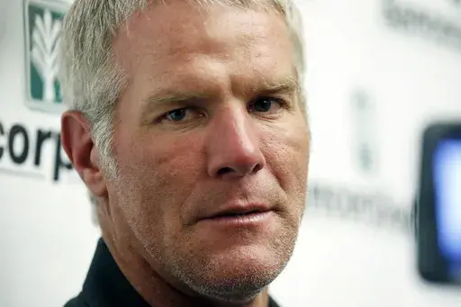 Former NFL football quarterback Brett Favre speaks with reporters prior to his induction to the Mississippi Hall of Fame, Aug. 1, 2015, in Jackson, Miss. A Mississippi judge on Thursday, July 11, 2024, removed one of the attorneys representing Favre in a civil lawsuit filed in 2022 by the Mississippi Department of Human Services, which seeks to recover welfare money that the state auditor says was misspent on projects including a university volleyball arena backed by Favre. (AP Photo/Rogelio V. 