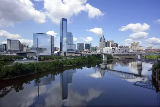 The Nashville, Tenn., skyline is reflected in the Cumberland River July 11, 2022. For years, Nashville leaders have watched Tennessee's GOP-dominated Legislature repeatedly kneecap the liberal-leaning city's ability to set its own minimum wage, regulate plastic bag use and place higher scrutiny on police officers. Yet that simmering tension has only escalated in 2023 as Republican lawmakers have introduced a string of proposals that local officials warn would drastically upend Music City.(AP Pho
