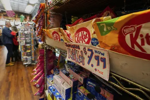 Kit Kats from Japan are displayed for sale at Economy Candy in New York's Lower East Side, Friday, April 4, 2025. (AP Photo/Richard Drew)