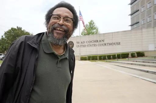 Civil rights activist and Jackson resident Frank Figgers prepares to enter the Thad Cochran U.S. Courthouse in Jackson, Miss., Monday, May 22, 2023. Figgers opposes a Mississippi law that would create a court in part of Jackson with a judge and prosecutors who would be appointed rather than elected. (AP Photo/Rogelio V. Solis, File)
