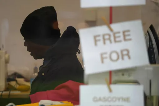 Local resident Dave sits at the Community Food Hub in London, Wednesday, May 4, 2022. Across Britain, food banks and community food hubs that helped struggling families, older people and the homeless during the pandemic are now seeing soaring demand. The cost of food and fuel in the U.K. has risen sharply since late last year, with inflation reaching the highest level in 40 years.  (AP Photo/Frank Augstein)