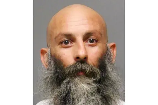 This undated booking photo provided by the Delaware Department of Justice shows Barry Croft Jr. Croft, a Delaware trucker described as a co-leader of the conspiracy to kidnap Michigan’s governor, was sentenced to more than 19 years in prison Wednesday, Dec. 28, 2022, a day after an accomplice received 16 years behind bars. (Delaware Department of Justice via AP, File)