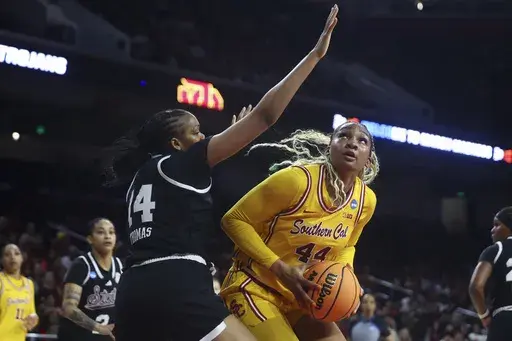 Southern California forward Kiki Iriafen (44) drives against Mississippi State forward Kayla Thomas (14) during the first half in the second round of the NCAA college basketball tournament Monday, March 24, 2025, in Los Angeles. (AP Photo/Jessie Alcheh)