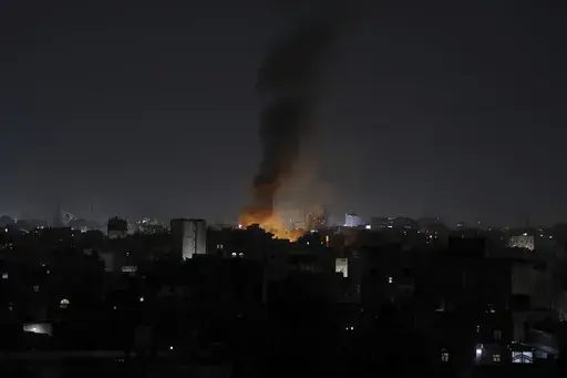 Smoke rises from a location reportedly struck by U.S. airstrikes in Sanaa, Yemen, Wednesday, March 19, 2025. (AP Photo/Osamah Abdulrahman)