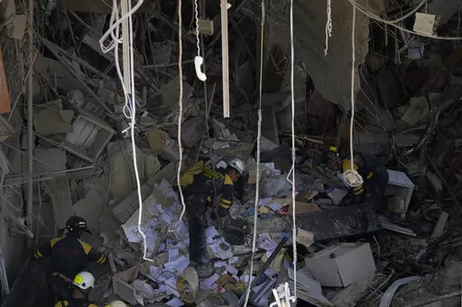 Rescuers search for survivors at the site of Friday's deadly explosion that destroyed the five-star Hotel Saratoga, in Havana, Cuba, Saturday, May 7, 2022. (AP Photo/Ramon Espinosa)