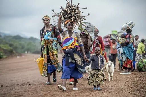 Residents flee fighting between M23 rebels and Congolese forces near Kibumba, some 20 kms ( 12 miles) North of Goma, Democratic Republic of Congo, on Oct. 29, 2022. A senior UN official said Tuesday, Sept. 5, 2023, the humanitarian situation in conflict-wracked eastern Congo has deteriorated alarmingly in the past 18 months with 8 million people in urgent need of assistance and women and girls subjected to sexual violence on a massive scale -- just in three provinces. (AP Photo/Moses Sawasawa, F