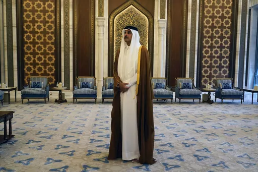 Qatari Emir Sheikh Tamim bin Hamad Al Thani waits for the arrival of U.S. Secretary of State Antony Blinken in Lusail, Qatar, Friday Oct. 13, 2023. On Friday, Oct. 20, The Associated Press reported on stories circulating online incorrectly claim that a video shows Qatar’s emir threatening to cut off the world’s natural gas supply if Israel doesn’t stop bombing Gaza. (AP Photo/Jacquelyn Martin, Pool, File)