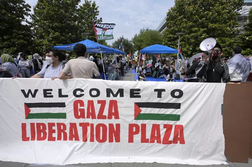 People gather to protest against the Israel-Hamas war at a plaza at the University of Texas at Dallas, Wednesday, May 1, 2024, in Richardson, Texas. (AP Photo/LM Otero, File)