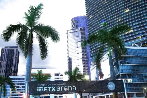 Signage for the FTX Arena, where the Miami Heat basketball team plays, is visible Saturday, Nov. 12, 2022, in Miami. Sam Bankman-Fried received numerous plaudits as he rapidly achieved superstar status as the head of cryptocurrency exchange FTX: the savior of crypto, the newest force in Democratic politics and potentially the world’s first trillionaire. Now the comments about the 30-year-old aren’t so kind after FTX filed for bankruptcy protection Friday, Nov. 11 leaving his investors and cu