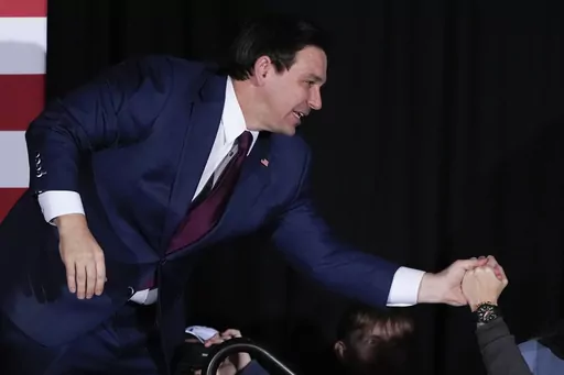 Republican presidential candidate Florida Gov. Ron DeSantis greets supporters during a caucus night party, Monday, Jan. 15, 2024, in West Des Moines, Iowa. (AP Photo/Charlie Neibergall)