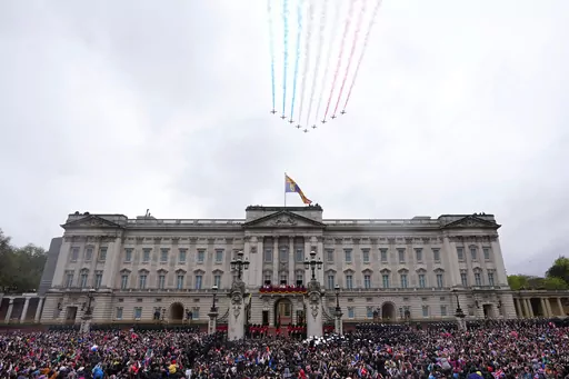 Britain's King Charles III and Queen Camilla on the balcony of Buckingham Palace watch the Royal Air Force Red Arrows fly over after their coronation ceremony, in London, on May 6, 2023. A change in monarchs, double-digit inflation and ongoing costs of renovating Buckingham Palace contributed to a 5% increase in publicly-funded spending by Britain's royals, royal accounts published Thursday, June 29, 2023 showed. (AP Photo/Petr David Josek, File)