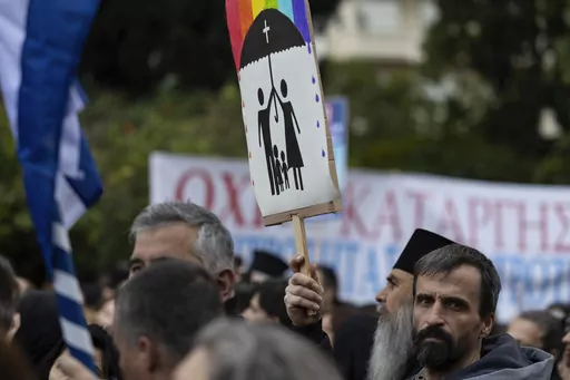 A protester raises a banner during a rally against same-sex marriage, at central Syntagma square, in Athens, Greece, Sunday, Feb. 11, 2024. Greece is becoming the first majority-Orthodox Christian nation to legalize same-sex marriage. At least for the near future, it will be the only one. The Eastern Orthodox leadership, despite lacking a single doctrinal authority like a pope, has been unanimous in opposing recognition of same-sex relationships. (AP Photo/Yorgos Karahalis, File)