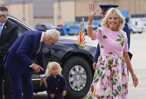 President Joe Biden looks at his grandson Beau Biden as first lady Jill Biden waves and walks to board Air Force One at Andrews Air Force Base, Md., Aug. 10, 2022. Jill Biden has tested negative for COVID-19 and will leave South Carolina, where she's been isolated since vacationing with President Joe Biden. Her office says the 71-year-old first lady will rejoin the president at their Delaware beach home later Sunday, Aug. 21, 2022. (AP Photo/Manuel Balce Ceneta, File)