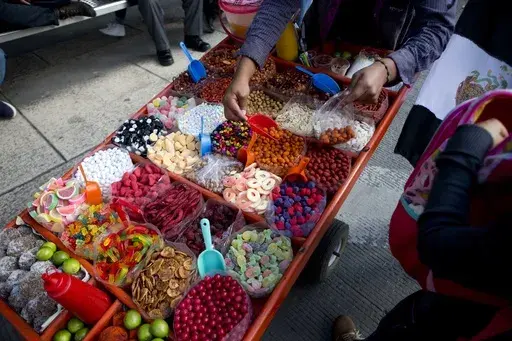 A street vendor sells sweet snacks in Mexico City, July 5, 2016. (AP Photo/Eduardo Verdugo, File)