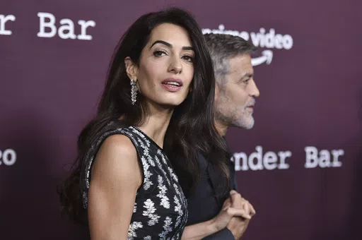 Amal Clooney, left, and George Clooney arrive at a screening of "The Tender Bar," Oct. 3, 2021, at the Directors Guild of America in Los Angeles. Amal Clooney is one of the legal experts who recommended that the world's top war crimes court seek arrest warrants for Israeli Prime Minister Benjamin Netanyahu and leaders of the militant Hamas group, Clooney announced Monday, May 20, 2024. (Photo by Richard Shotwell/Invision/AP, File)