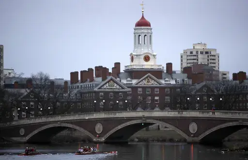 Rowers paddle down the Charles River near the campus of Harvard University in Cambridge, Mass., March 7, 2017. (AP Photo/Charles Krupa, File)