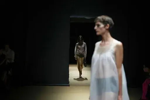 A model wears a creation as part of the Prada women's Spring Summer 2023 collection presented in Milan, Italy, Thursday, Sept. 22, 2022. (AP Photo/Antonio Calanni)