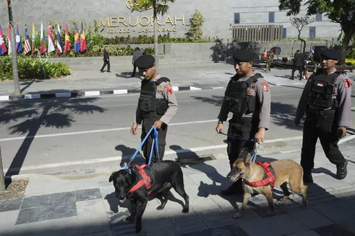 Indonesian police K9 patrol in front of Meruorah hotel in Labuan Bajo, East Nusa Tenggara province, Indonesia, Monday, May 8, 2023. Indonesian President Joko Widodo will host fellow leaders of the Association of Southeast Asian Nations this week in their annual summit in Labuan Bajo. (AP Photo/Achmad Ibrahim)