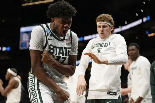 Michigan State guard Jase Richardson (11) reacts to play against Mississippi during the first half in the Sweet 16 of the NCAA college basketball tournament, Friday, March 28, 2025, in Atlanta. (AP Photo/George Walker IV)