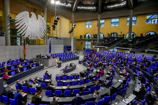 Lawmakers attend a debate about a vaccination mandate at the parliament Bundestag in Berlin, Germany, Wednesday, Jan. 26, 2022. (AP Photo/Markus Schreiber)