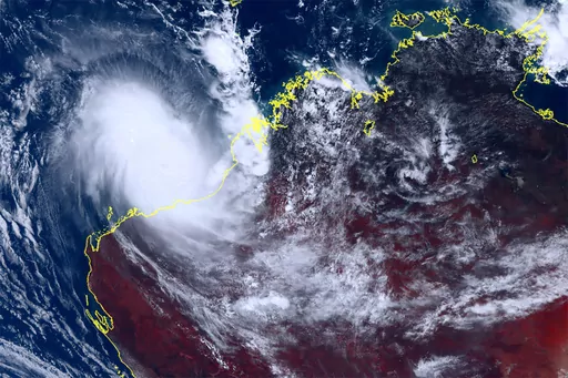This satellite image taken by Himawari-8, a Japanese weather satellite, and provided by National Institute of Information and Communications Technology, shows cyclone Ilsa approaching Australia's west coast, Thursday, April 13, 2023. A severe tropical cyclone lashed the northwest Australian coast with strengthening winds and increasing rain Thursday as authorities warned the population to prepare for destructive gusts of up to 275 kph (171 mph). (Courtesy of National Institute of Information and
