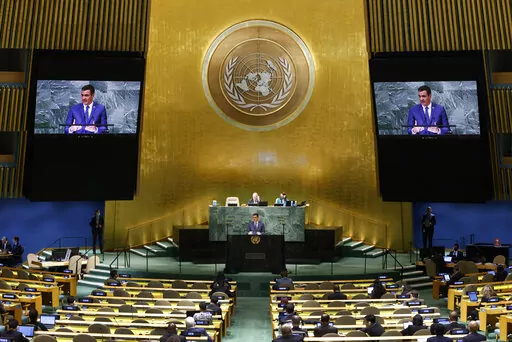 President of Spain Pedro Sanchez, center bottom, addresses the 77th session of the United Nations General Assembly at U.N. headquarters, Thursday, Sept. 22, 2022. (AP Photo/Jason DeCrow)