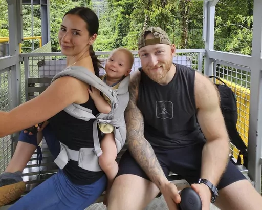 This undated photo provided by John Flickinger, Friday, April 5, 2024, shows Sandy Leclerc, left, and Jacob Flickinger with their son Jasper. Flickinger was one of seven World Central Kitchen aid workers unloading food from their vehicles when they were killed by Israeli airstrikes Monday, April 1, in Gaza. (John Flickinger via AP)