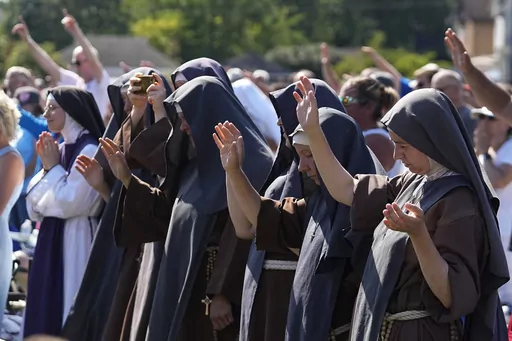 Attendees pray during a "rosary rally" on Sunday, Aug. 6, 2023, in Norwood, Ohio. On Nov. 7, Ohio voters approved a constitutional amendment that ensures access to abortion. It was the seventh consecutive state where voters decided to protect abortion access since the U.S. Supreme Court overturned the constitutional right to abortion in June 2022. (AP Photo/Darron Cummings, File)