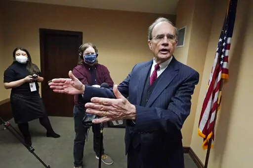 Mississippi Lt. Gov. Delbert Hosemann tells reporters Tuesday, Jan. 4, 2022, that the state should provide health insurance for working people, but sharply rebuffed a question about expanding Medicaid, at the Mississippi State Capitol in Jackson, Miss., following the start of the latest Legislative Session, Tuesday, Jan. 4, 2022. (AP Photo/Rogelio V. Solis)