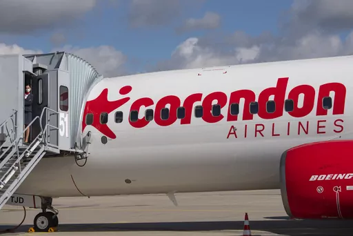 Senior cabin crew member Magdalini Michailidou stands on the gangway prior the first holiday flight of the Corendon Airlines Europe to the Greek destination Rhodos at the airport Erfurt-Weimar in Erfurt, Germany, July 2, 2020. Corendon Airlines says that it will sell an adults-only zone — no one under 16 allowed — on flights between Amsterdam and Curacao starting in November 2023. The Turkish carrier says people traveling without children will get quiet surroundings, and parents won't have t