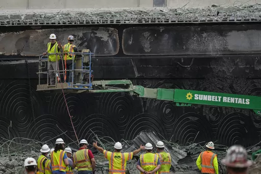 Crews continue to work the scene of a collapsed elevated section of Interstate 95, in Philadelphia, Wednesday, June 14, 2023. (AP Photo/Matt Rourke)