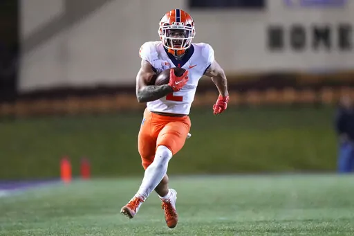 Illinois running back Chase Brown runs against Northwestern during the second half of an NCAA college football game in Evanston, Ill., Saturday, Nov. 26, 2022. Illinois won 41-3. (AP Photo/Nam Y. Huh)