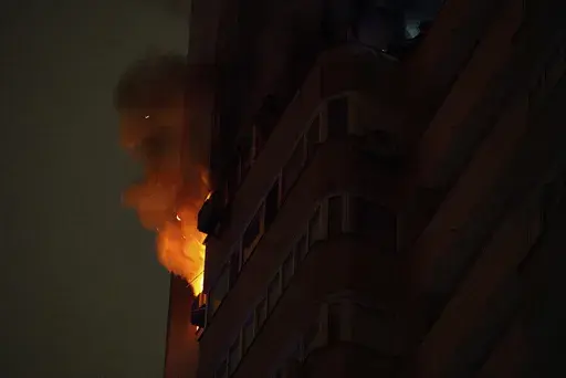 Flames and smoke rise from a residential building after the attack of Russian drones in Kyiv, Ukraine, Friday, Oct. 26, 2024. (AP Photo/Alex Babenko)