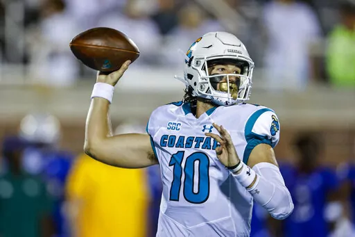 Coastal Carolina quarterback Grayson McCall looks to pass against Kansas during the first half of an NCAA college football game in Conway, S.C., Friday, Sept. 10, 2021. The Sun Belt Conference has done plenty to past few seasons to catch college football's attention. Those in charge believe the league took additional steps this offseason to keep that going. (AP Photo/Nell Redmond, File)