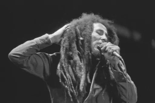 Jamaican Reggae singer Bob Marley performs in front of an audience of 40,000 during a festival concert of Reggae in Paris, France, July 4, 1980. The biopic “Bob Marley: One Love” has been a box office hit in the United States and several other countries. The film, starring Kingsley Ben-Adir, is focused on the Rastafari legend’s story during the making of his 1977 album “Exodus” while leading up to his impactful concert in his native Jamaica. (AP Photo/Jacques Langevin, File)