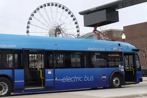 A Chicago Transit Authority electric bus charges at Navy Pier Tuesday, Feb. 14, 2023, in Chicago. The Biden administration is awarding nearly $2 billion in grants to help restart or expand electric vehicle manufacturing and assembly sites in eight states, including the presidential battlegrounds of Michigan, Pennsylvania and Georgia. Grants totaling $1.7 billion will be issued by the Energy Department to create or retain thousands of union jobs and support auto-based communities that have long d