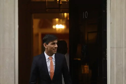 FILE -British newly appointed Chancellor of the Exchequer Rishi Sunak leaves 10 Downing Street, where he was given the job by Britain's Prime Minister Boris Johnson, in London, Thursday, Feb. 13, 2020. Sunak ran for Britain’s top job and lost. Now he’s back with a second chance to become prime minister. (AP Photo/Matt Dunham, File)
