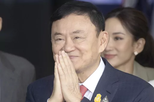 Thailand's former Prime Minister Thaksin Shinawatra greets his supporters as he arrives at Don Muang airport in Bangkok, Thailand, Tuesday, Aug. 22, 2023. Thailand's king granted former prime minister Thaksin a pardon and reduced his eight-year prison sentence to one year, just over a week after the business tycoon-turned-politician returned from 15 years of self-imposed exile. The pardon granted by King Maha Vajiralongkorn was published Friday, Sept. 1, 2023, in the Royal Gazette, making it eff
