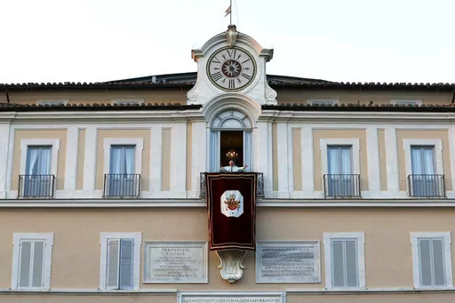 Pope Benedict XVI greets faithful from his summer residence of Castel Gandolfo, the scenic town where he spent his first post-Vatican days and made his last public blessing as pope, Feb. 28, 2013. Pope Emeritus Benedict XVI's death has hit Castel Gandolfo's "castellani" particularly hard, since many knew him personally, and in some ways had already bid him an emotional farewell when he uttered his final words as pope from the palace balcony overlooking the town square. (AP Photo/Luca Bruno, File