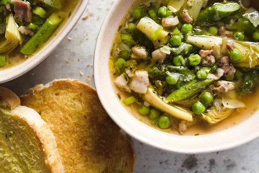This image released by Milk Street shows a recipe for Tuscan-style spring vegetable soup. (Milk Street via AP)