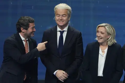Andre Ventura, leader of Portugal populist right wing party Chega, left, speaks with Dutch far right wing politician Geert Wilders, center and French far-right leader Marine Le Pen during the far-right Patriots for Europe summit in Madrid, Spain, Saturday, Feb. 8, 2025. (AP Photo/Paul White, File)