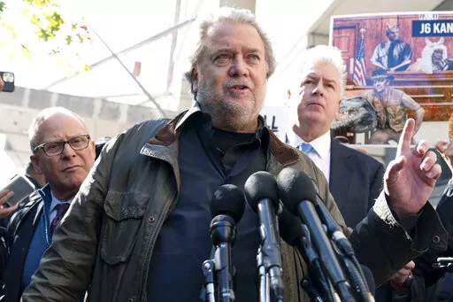 Steve Bannon, center, a longtime ally of former President Donald Trump and convicted of contempt of Congress,  accompanied by his attorneys David Schoen, left, and Evan Corcoran, right, speaks to the media as he leaves the federal courthouse on Friday, Oct. 21, 2022, in Washington. Bannon was sentenced to 4 months behind bars for defying a Jan. 6 committee subpoena. ( AP Photo/Jose Luis Magana)