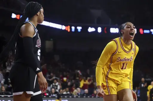 Southern California guard Kennedy Smith (11) reacts as Mississippi State guard Chandler Prater (5) watches during the first half in the second round of the NCAA college basketball tournament Monday, March 24, 2025, in Los Angeles. (AP Photo/Jessie Alcheh)