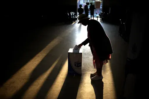 A woman casts her ballot at a polling station, during general elections in Eshowe, South Africa, on May 29, 2024. South Africa is in a moment of deep soul-searching after an election that brought a jarring split from the African National Congress, the very party that gave the country freedom and democracy 30 years ago. (AP Photo/Emilio Morenatti, File)