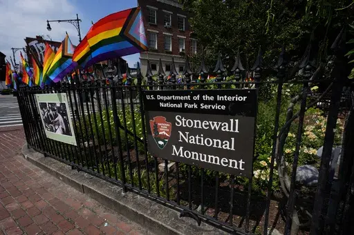A National Park Service sign marks the Stonewall National Monument outside the Stonewall Inn, Monday, June 17, 2024, in New York. (AP Photo/Pamela Smith, File)