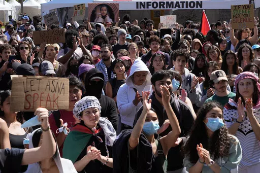 Students protest a canceled commencement speech by its 2024 valedictorian who has publicly supported Palestinians on the campus of University of Southern California on Thursday, April 18, 2024. U.S. colleges and universities are preparing for end-of-year commencement ceremonies with a unique challenge: providing safety for graduates while honoring the free speech rights of students involved in protests over the Israel-Hamas war. (AP Photo/Damian Dovarganes, File)