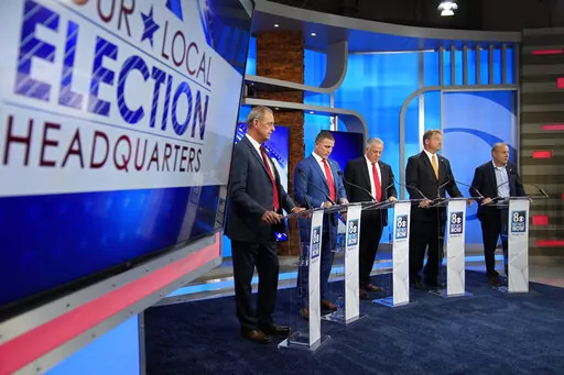 From left, North Las Vegas Mayor John Lee, Joey Gilbert, Clark County Sheriff Joe Lombardo, former U.S. senator Dean Heller and Guy Nohra stand before a Republican primary debate for Nevada governor May 25, 2022, in Las Vegas. (AP Photo/John Locher, Pool, File)