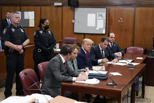 Former President Donald Trump appears in court for his arraignment on April 4, 2023, in New York. On Monday, April 24, New York prosecutors asked a judge to bar Trump from using evidence from his criminal case to attack witnesses, citing what they say is the former president's history of making “harassing, embarrassing and threatening statements,” about people he's tangled with in legal disputes. (AP Photo/Seth Wenig, Pool, File)