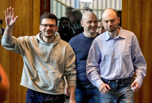 Freed Russian prisoners Ilya Yashin, Andrei Pivovarov and Vladimir Kara-Murza, from left, enter a press conference in Bonn, Germany, Friday, Aug. 2, 2024, a day after they were released as part of a 24-person prisoner swap between Russia and the United States. (AP Photo/Michael Probst)